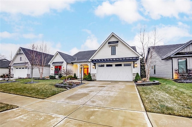 view of front of property with a garage and a front lawn