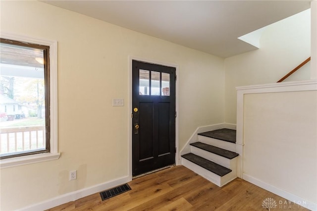 foyer entrance with hardwood / wood-style flooring