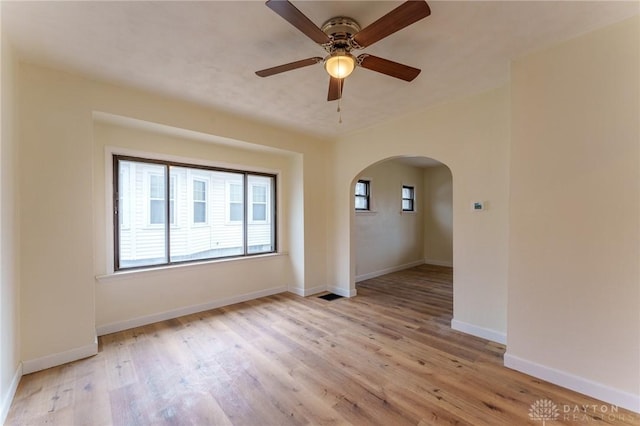 unfurnished room featuring ceiling fan and light wood-type flooring