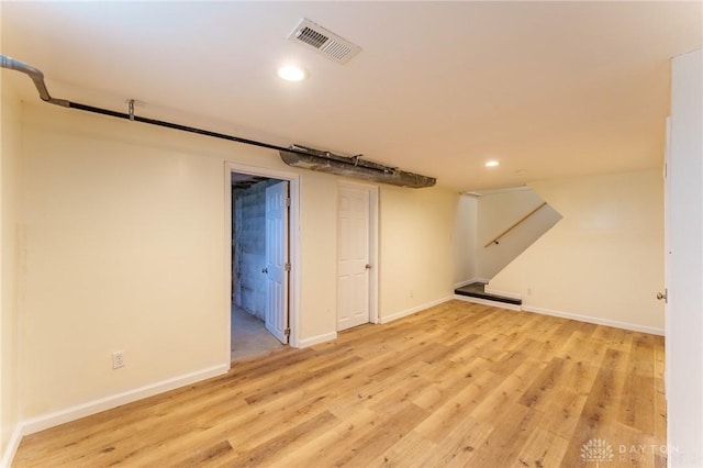 basement featuring light hardwood / wood-style flooring