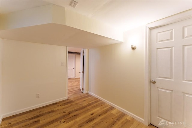 corridor featuring hardwood / wood-style floors