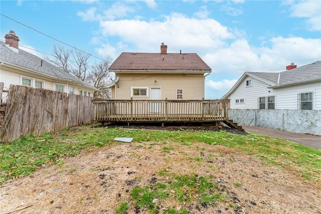 back of property with a deck