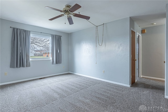 carpeted empty room featuring ceiling fan