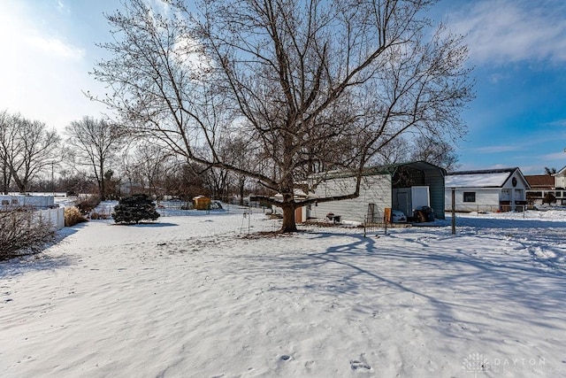 view of yard layered in snow