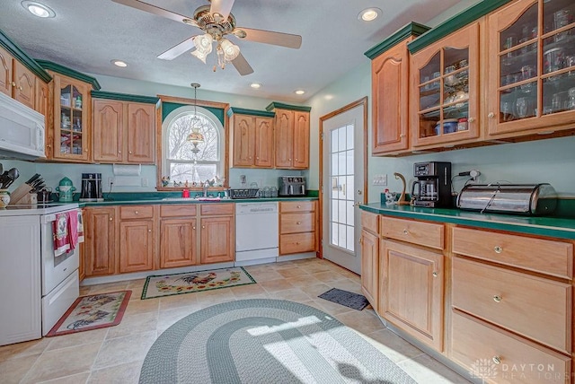 kitchen with ceiling fan, sink, white appliances, and decorative light fixtures