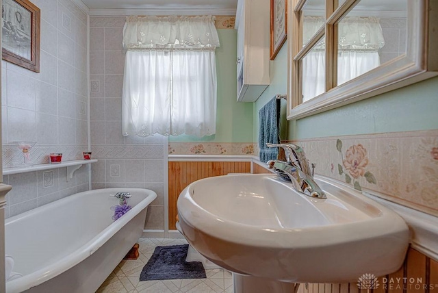 bathroom featuring sink, tile walls, tile patterned floors, and a bathtub