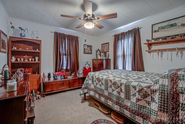 bedroom with light colored carpet and ceiling fan