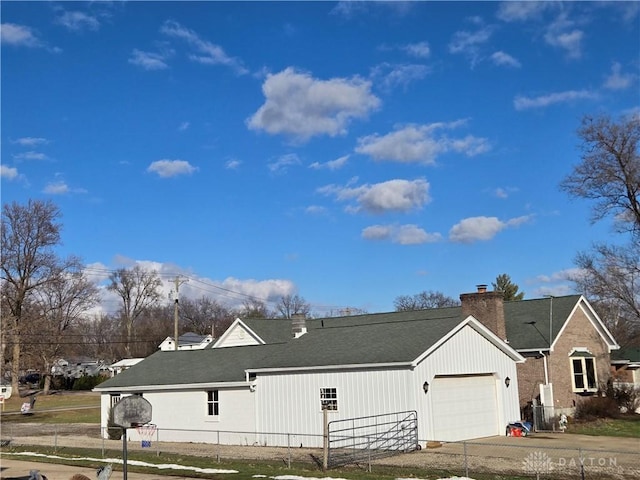 view of side of property featuring a garage