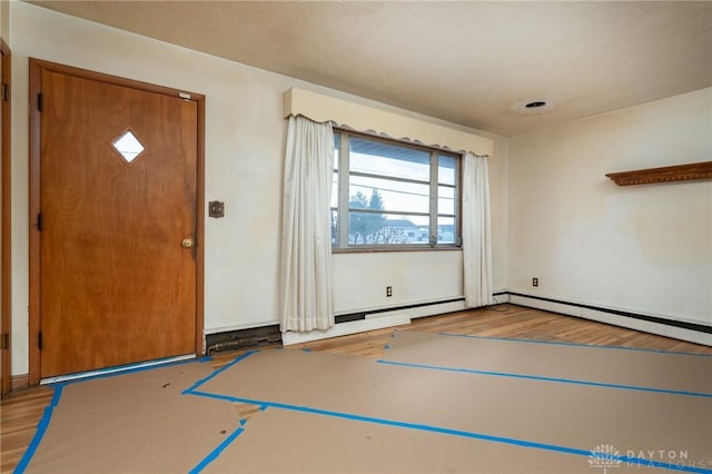 foyer entrance with light hardwood / wood-style flooring