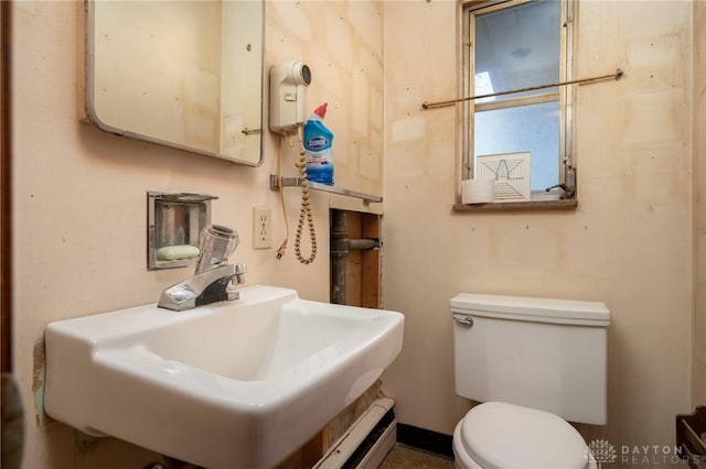 bathroom featuring toilet and sink