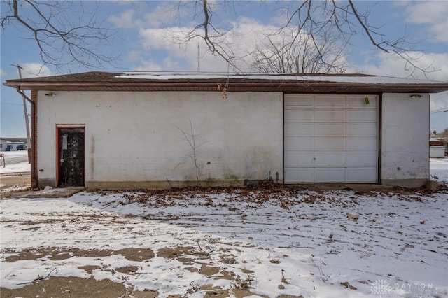 view of snow covered garage