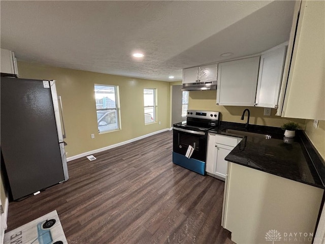 kitchen featuring white cabinetry, sink, stainless steel appliances, and dark hardwood / wood-style floors