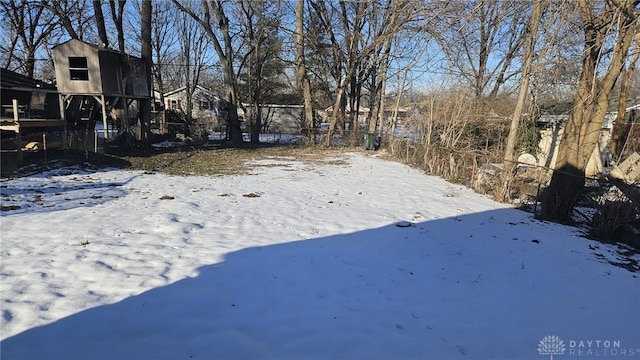 view of yard layered in snow