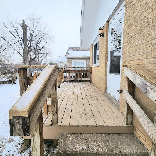 view of snow covered deck