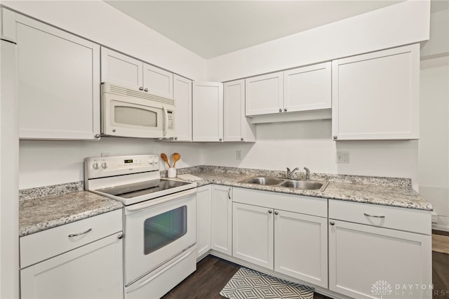 kitchen featuring sink, white appliances, dark hardwood / wood-style floors, and white cabinets