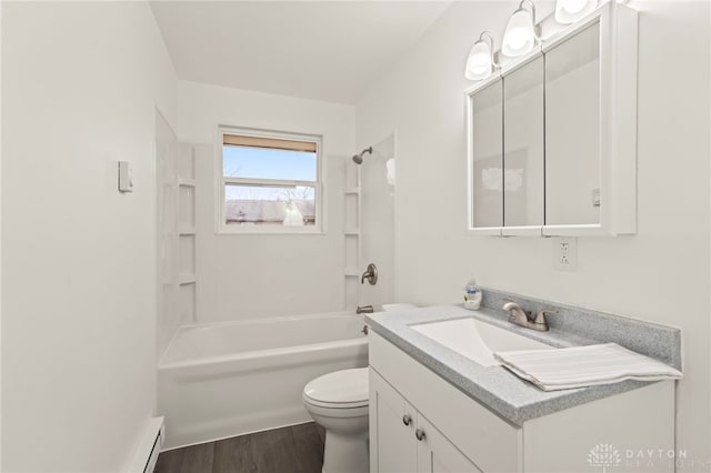 full bathroom featuring vanity, toilet,  shower combination, and hardwood / wood-style floors