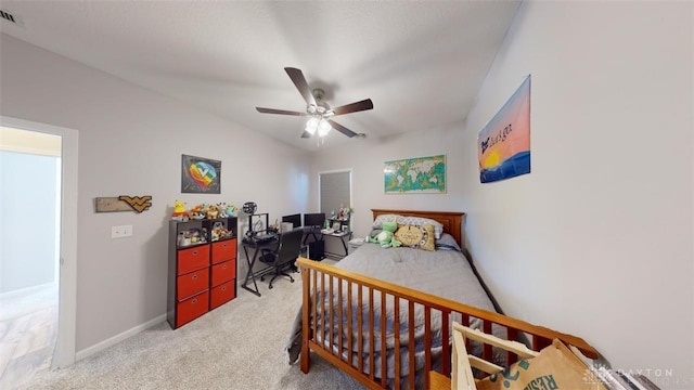 bedroom featuring ceiling fan and light carpet