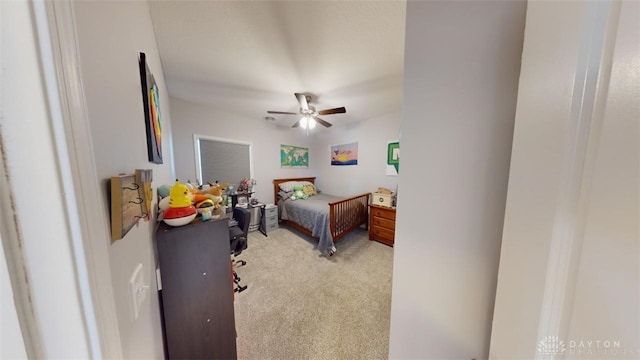 bedroom with light colored carpet and ceiling fan