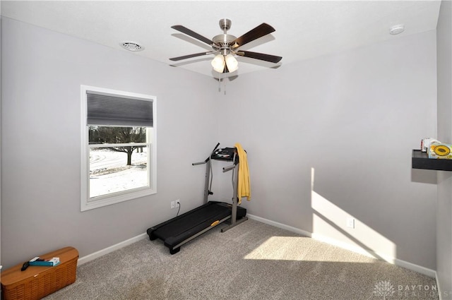 exercise room with carpet floors and ceiling fan