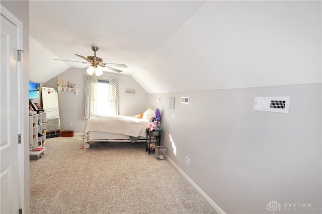 bedroom featuring ceiling fan, vaulted ceiling, and carpet