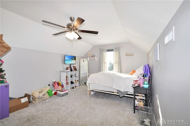 bedroom with lofted ceiling, ceiling fan, and carpet