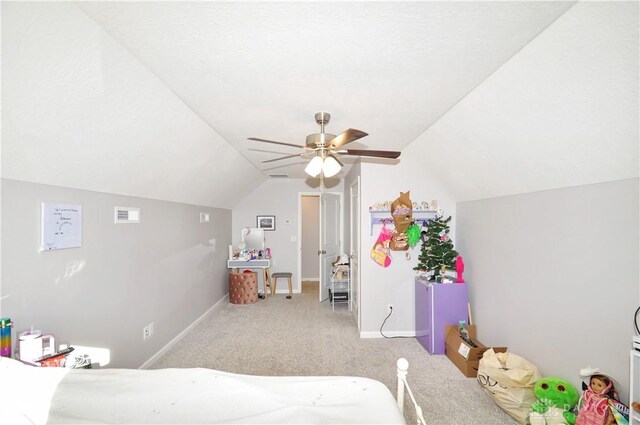 carpeted bedroom featuring ceiling fan and vaulted ceiling