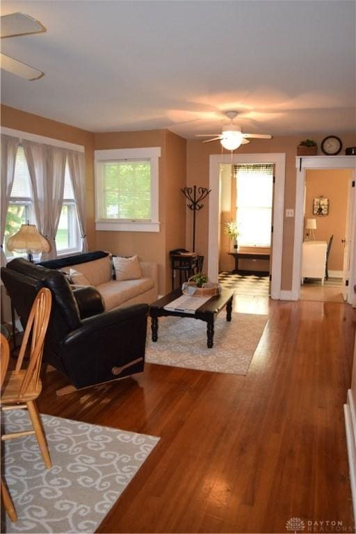 living room with plenty of natural light, hardwood / wood-style floors, and ceiling fan