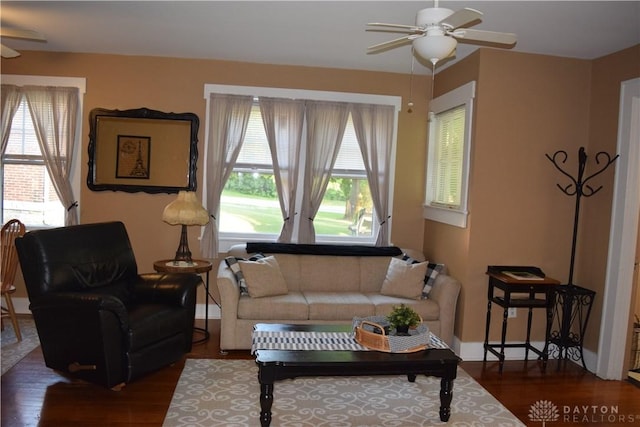 living room featuring hardwood / wood-style flooring, plenty of natural light, and ceiling fan