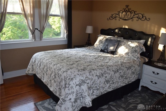 bedroom featuring dark hardwood / wood-style flooring