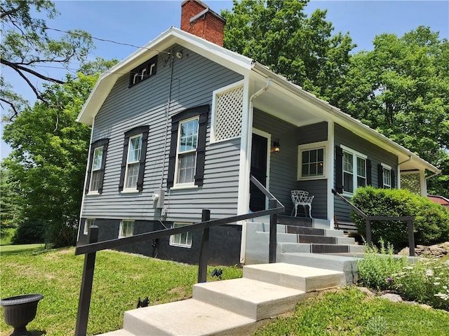 2282 Whitey Marshall Dr, Beavercreek, OH 45434 - view of front facade with a chimney and a front lawn
