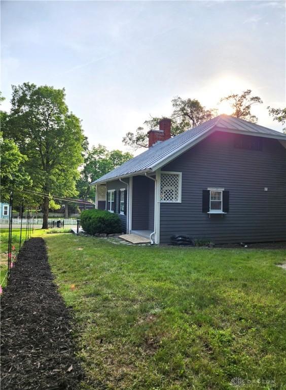 2282 Whitey Marshall Dr, Beavercreek, OH 45434 - rear view of house featuring a chimney and a metal roof