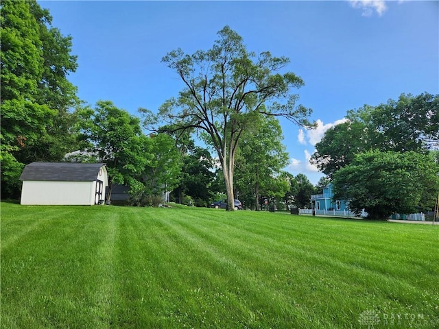 2282 Whitey Marshall Dr, Beavercreek, OH 45434 - view of green lawn featuring a storage unit