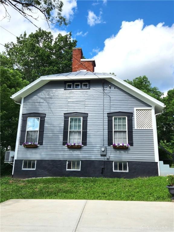 2282 Whitey Marshall Dr, Beavercreek, OH 45434 - view of side of home with a chimney and a yard