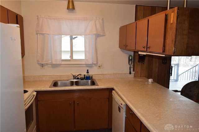 kitchen with sink and white appliances