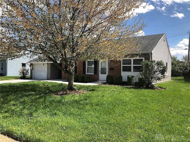 view of front of property with a garage and a front yard