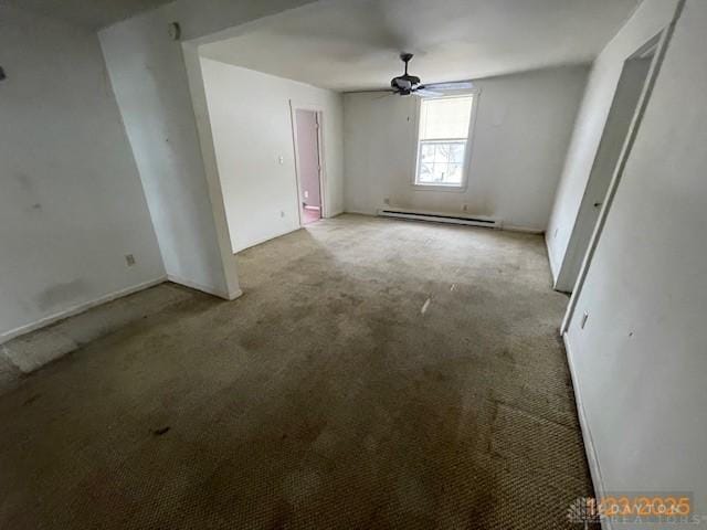 carpeted empty room featuring a baseboard radiator and ceiling fan