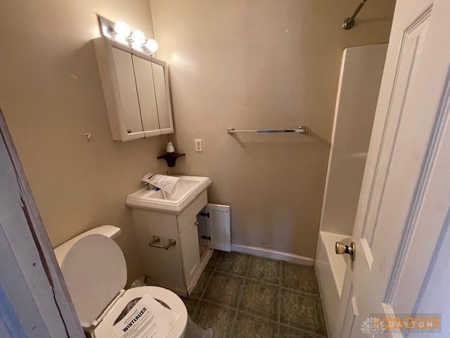 full bathroom with vanity, toilet, and shower / washtub combination