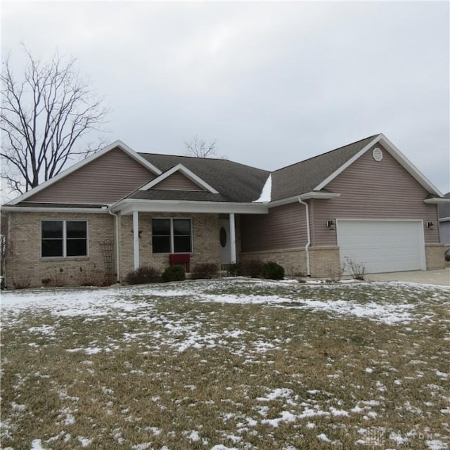 ranch-style house with brick siding and an attached garage