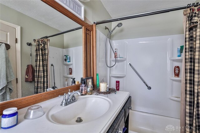 full bathroom featuring shower / tub combo with curtain and vanity