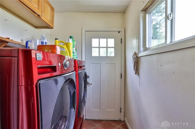 laundry room featuring cabinet space, tile patterned flooring, and independent washer and dryer