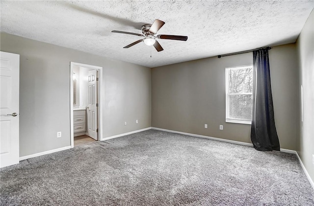 unfurnished room with ceiling fan, light colored carpet, and a textured ceiling