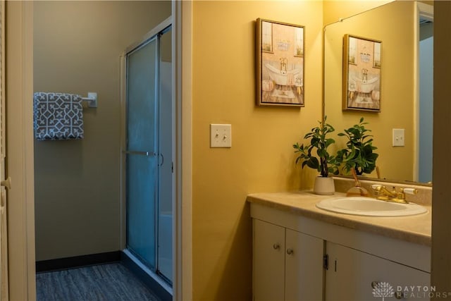 full bathroom featuring vanity and a shower stall