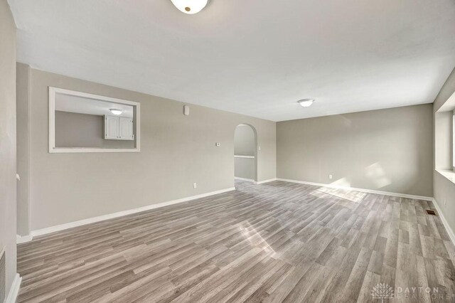 spare room featuring light wood-type flooring