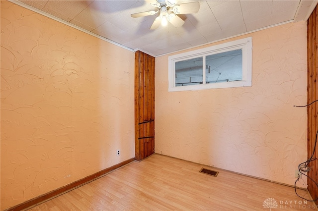 spare room with ceiling fan and light hardwood / wood-style floors