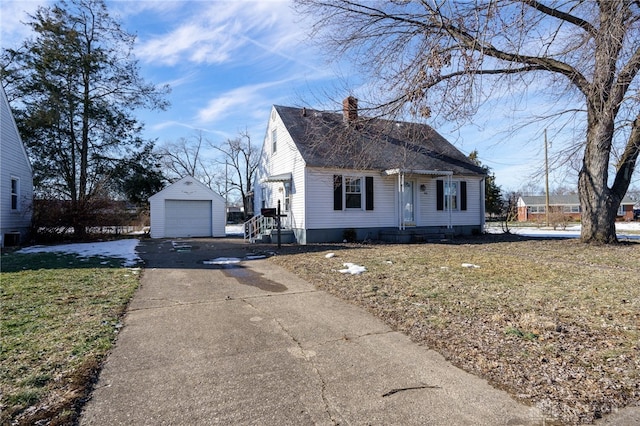 view of front of property with a garage and an outdoor structure