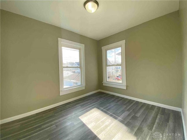 empty room featuring dark hardwood / wood-style floors