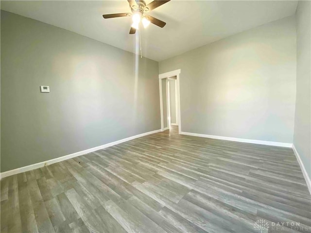 empty room featuring ceiling fan and hardwood / wood-style floors