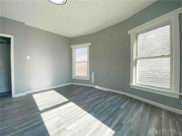 empty room featuring dark hardwood / wood-style floors