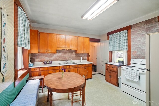 120 E State Route 73, Springboro, OH 45066 - kitchen featuring white appliances, light countertops, a sink, and light floors