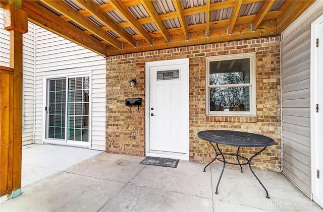 doorway to property with a patio area